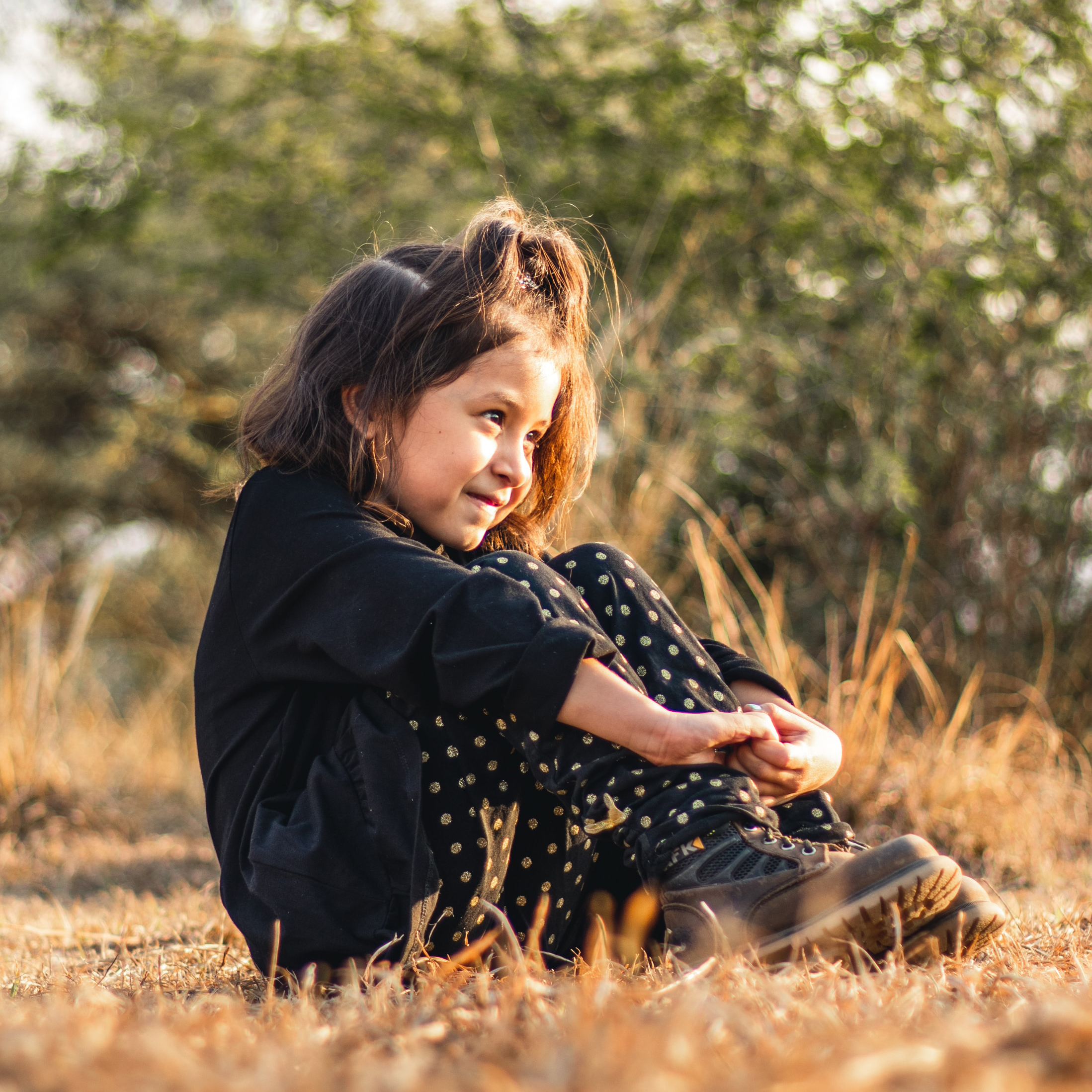 Small girl sitting and smiling